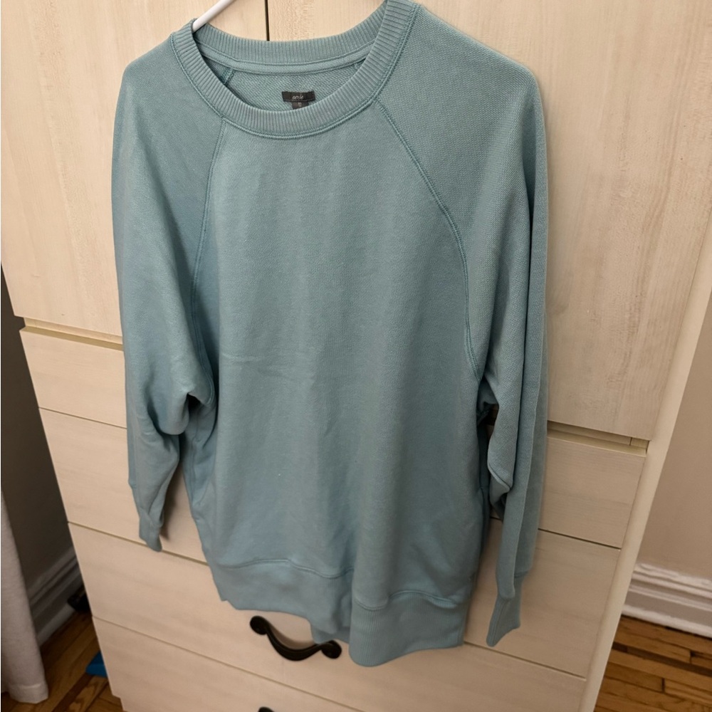 Woman’s  Blue Sweater